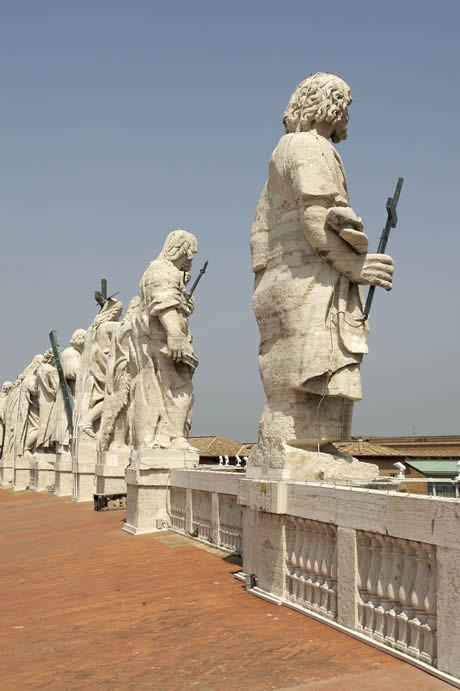 Statues at the top of St Peter s facade in Vatican City photo