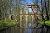 Ancient Roman Aqueduct Reflecting In A Pool Of Water